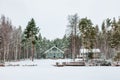 Wooden cottage in snow covered forest in Finland Royalty Free Stock Photo