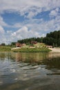 Wooden cottages on the river Chusovaya