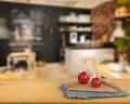 Wooden counter top with tomato and chopping board