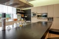 Wooden countertop on blurred background of functional kitchen