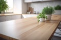 wooden countertop with green plants on the background of the interior of a kitchen with window Royalty Free Stock Photo