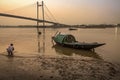 Wooden country boat at Princep Ghat on river Hooghly at dusk.