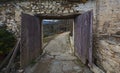 Wooden courtyard door in an old Christian monastery in Greece. Royalty Free Stock Photo