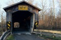 Wooden covered bridge on rural road Royalty Free Stock Photo