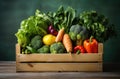 Wooden crate of farm fresh vegetables with cauliflower, tomatoes, zucchini, turnips and colorful sweet bell peppers on a Royalty Free Stock Photo