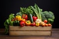 Wooden crate of farm fresh vegetables with cauliflower, tomatoes, zucchini, turnips and colorful sweet bell peppers on a Royalty Free Stock Photo