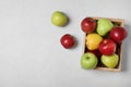 Wooden crate filled with fresh juicy apples on table, top view Royalty Free Stock Photo