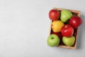 Wooden crate filled with fresh juicy apples on table, top view Royalty Free Stock Photo