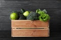 Wooden crate full of fresh green fruits and vegetables Royalty Free Stock Photo