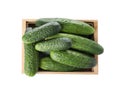Wooden crate full of fresh ripe cucumbers on white background