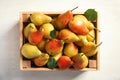 Wooden crate with ripe pears on light background Royalty Free Stock Photo