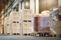 Wooden Crates and Barrel Tank Wrapped Plastic Stacked on Pallets in Warehouse. Cargo Supplies Warehouse Shipping Logistics Royalty Free Stock Photo