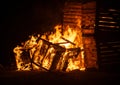Wooden Crates on fire at night