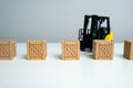 Wooden crates and forklift. Production and freight of goods. Transport department. Effective logistics and supply chain management