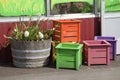 Wooden crates and old half barrell.