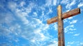 Wooden cross against clouds and blue sky. Concept of hope, Easter celebration, resurrection, divine presence, religious