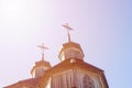 Wooden Cross Background. Wooden cross on a simple steeple set against a blue sky. Church Roof with a cross. Church Royalty Free Stock Photo