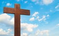 Wooden cross on the blue sky cloudy