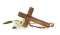 Wooden cross, crown of thorns and blossom lilies