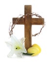 Wooden cross, crown of thorns, Easter eggs and blossom lily Royalty Free Stock Photo