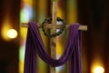 Wooden cross, crown of thorns and purple fabric Royalty Free Stock Photo