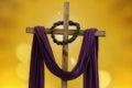 Wooden cross, crown of thorns and purple fabric - lent theme Royalty Free Stock Photo