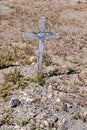 Wooden cross on desert grave Royalty Free Stock Photo