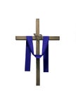 Wooden cross draped with purple fabric and thorns Royalty Free Stock Photo