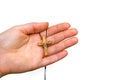 Wooden cross in female hand isolated on white Royalty Free Stock Photo