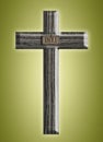 Wooden cross on a green background