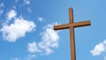 Wooden cross isolated on the blue sky. Royalty Free Stock Photo