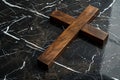 Wooden Cross on Black Marble Floor