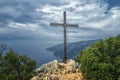 Wooden Cross on a rock on Mount Athos above the sea.