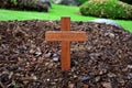 A wooden cross rose to the ground with natural background,