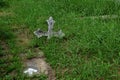 A wooden cross rose to the ground with natural background,