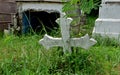 A wooden cross rose to the ground with natural background,