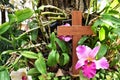 A wooden cross rose to the ground with natural background,