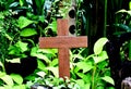 A wooden cross rose to the ground with natural background,