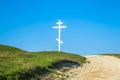 A wooden cross on top of a hill Royalty Free Stock Photo