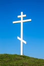 A wooden cross on top of a hill Royalty Free Stock Photo