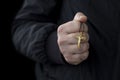 Wooden crucifix in male hand