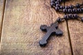 Wooden crucifix, or rustic wooden rosary. Catholic or Christian symbol of faith Royalty Free Stock Photo