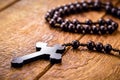 Wooden crucifix, or rustic wooden rosary. Catholic or Christian symbol of faith Royalty Free Stock Photo