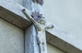 Wooden crucifix on the wall closeup. Image of Jesus. Horizontal photography with Unfocused distant plan Royalty Free Stock Photo