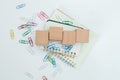 Wooden cube block empty on notebook with paper clip on white table. business object sign information. education and learning Royalty Free Stock Photo