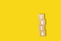 Wooden cube block with IDEA word.Concept creative idea and innovation on yellow background