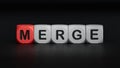 wooden cube block with MERGE business word.