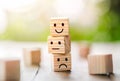 Wooden cube block shape with icon face smiley, The best excellent business services rating customer experience,Satisfaction survey Royalty Free Stock Photo