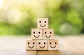 Wooden cube block shape with icon face smiley, The best excellent business services rating customer experience,Satisfaction survey Royalty Free Stock Photo