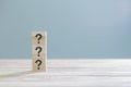 Wooden cube block with sign question mark symbol on wood table with with copy space Royalty Free Stock Photo